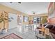 Spacious living room with white tile floors, a sliding barn door, and access to the outdoor balcony at 614 Norton St, Longboat Key, FL 34228