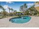 Backyard pool, landscaped yard, and canal view make this home an oasis at 614 Norton St, Longboat Key, FL 34228