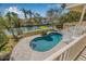 Inviting pool area with comfortable seating and lush landscaping overlooking the canal at 614 Norton St, Longboat Key, FL 34228