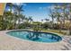 Beautiful pool with a table and chairs by the canal at 614 Norton St, Longboat Key, FL 34228