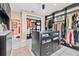 Spacious walk-in closet with custom shelving, drawers, and center island for organization at 614 Norton St, Longboat Key, FL 34228