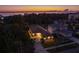 Sunset aerial view of waterfront home, showcasing its landscaping and neighborhood at 632 S Florida Ave, Tarpon Springs, FL 34689