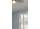 Comfortable bedroom with plantation shutters providing natural light and privacy at 632 S Florida Ave, Tarpon Springs, FL 34689