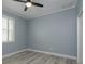 Cozy bedroom featuring a ceiling fan and natural light from a window at 632 S Florida Ave, Tarpon Springs, FL 34689