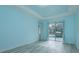 Light-filled bedroom with sliding door access to the pool area at 632 S Florida Ave, Tarpon Springs, FL 34689