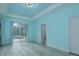 Bedroom with a view of the screened-in pool, and neutral paint at 632 S Florida Ave, Tarpon Springs, FL 34689