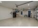 Spacious garage with epoxy flooring, ample storage, and overhead door system at 632 S Florida Ave, Tarpon Springs, FL 34689
