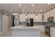 Elegant kitchen with white cabinetry, quartz countertops, and stainless steel appliances at 632 S Florida Ave, Tarpon Springs, FL 34689
