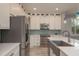 Well-equipped kitchen with stainless steel appliances and stylish finishes at 632 S Florida Ave, Tarpon Springs, FL 34689