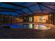 Inviting backyard pool and brick patio under a screened enclosure, perfect for relaxation at 632 S Florida Ave, Tarpon Springs, FL 34689