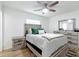 Bedroom features neutral walls, ceiling fan and wooden furniture set at 6521 Cedarbrook S Dr, Pinellas Park, FL 33782