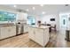 This upgraded kitchen features stainless steel appliances and a center island with seating at 6521 Cedarbrook S Dr, Pinellas Park, FL 33782