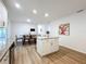 Bright kitchen flows into the dining area, and features stainless appliances, and a center island at 6521 Cedarbrook S Dr, Pinellas Park, FL 33782