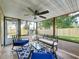 Screened patio with neutral furniture and a view of the fenced backyard at 6521 Cedarbrook S Dr, Pinellas Park, FL 33782