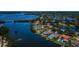 Stunning aerial view of waterfront community with homes boasting private pools and boat docks at 671 Tallahassee Ne Dr, St Petersburg, FL 33702