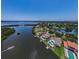 Aerial view of waterfront homes with pools and private docks on canal at 671 Tallahassee Ne Dr, St Petersburg, FL 33702