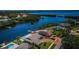 Aerial shot of a waterfront property with a private dock and lush landscaping at 671 Tallahassee Ne Dr, St Petersburg, FL 33702