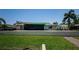 Lush backyard with an inviting patio and sparkling pool for outdoor enjoyment at 671 Tallahassee Ne Dr, St Petersburg, FL 33702