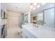 Bathroom with vanity, tile flooring, shower and tub at 671 Tallahassee Ne Dr, St Petersburg, FL 33702