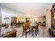 Spacious dining room featuring a chandelier, mirror wall, and seating for six at 671 Tallahassee Ne Dr, St Petersburg, FL 33702