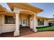 The front entrance features a decorative glass door, brick steps and walkway, and prominent white support columns at 671 Tallahassee Ne Dr, St Petersburg, FL 33702