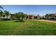 Inviting home with manicured lawn and tropical landscaping at 671 Tallahassee Ne Dr, St Petersburg, FL 33702