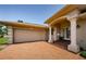 A two car garage is next to the front entrance with a brick driveway and walkway leading to the home at 671 Tallahassee Ne Dr, St Petersburg, FL 33702