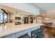 Bright kitchen features modern stainless steel appliances, stone countertops, and a breakfast bar with seating at 671 Tallahassee Ne Dr, St Petersburg, FL 33702