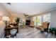 Comfortable living room with plenty of natural light, wood floors, and ceiling fan at 671 Tallahassee Ne Dr, St Petersburg, FL 33702
