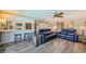 Inviting open-concept living area featuring modern flooring, white cabinetry, and comfortable seating, great for relaxation at 671 Tallahassee Ne Dr, St Petersburg, FL 33702