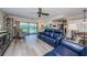 Living room with water view opens up to the adjacent kitchen and dining area at 671 Tallahassee Ne Dr, St Petersburg, FL 33702