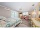 Bright bedroom with hardwood floors, neutral colors, and comfortable seating at 671 Tallahassee Ne Dr, St Petersburg, FL 33702