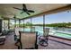 Screened-in patio with comfortable seating overlooking the pool and canal at 671 Tallahassee Ne Dr, St Petersburg, FL 33702