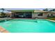 Inviting pool with spa and screened-in patio overlooking the water at 671 Tallahassee Ne Dr, St Petersburg, FL 33702