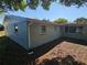 Backyard showcasing view of the home at 6731 Old Main St, New Port Richey, FL 34653