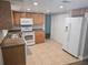 Bright kitchen featuring modern appliances and ample cabinet space at 6731 Old Main St, New Port Richey, FL 34653