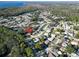 Aerial view shows the home's location within a quiet, tree-lined residential neighborhood at 700 Bowsprit Pl, Palm Harbor, FL 34685