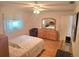 Bedroom showcasing bright light, a large mirror, and stylish decor at 700 Bowsprit Pl, Palm Harbor, FL 34685