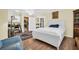 Comfortable bedroom with hardwood floors, and access to kitchen and study at 700 Bowsprit Pl, Palm Harbor, FL 34685