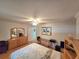 Comfortable bedroom featuring light wood floors, a dresser, and natural light at 700 Bowsprit Pl, Palm Harbor, FL 34685