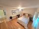 Bright bedroom with ceiling fan, wood floors, and a comfortable queen-size bed at 700 Bowsprit Pl, Palm Harbor, FL 34685