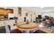 Open dining area with hardwood floors adjacent to kitchen and living spaces at 700 Bowsprit Pl, Palm Harbor, FL 34685