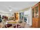 Bright dining area with hardwood floors and access to screened-in porch at 700 Bowsprit Pl, Palm Harbor, FL 34685
