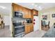 Modern kitchen features stainless steel appliances and ample cabinet space at 700 Bowsprit Pl, Palm Harbor, FL 34685