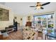 Bright living room featuring hardwood floors, a large window, and a comfortable seating area at 700 Bowsprit Pl, Palm Harbor, FL 34685