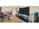 Spacious living room with hardwood floors, modern electronics, and comfortable seating at 700 Bowsprit Pl, Palm Harbor, FL 34685