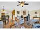 Inviting living room with hardwood floors, ceiling fan, and comfortable seating area at 700 Bowsprit Pl, Palm Harbor, FL 34685