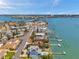 Breathtaking aerial view of the waterfront property with dock and ocean access at 7115 Bay St, St Pete Beach, FL 33706