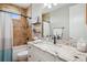 Bathroom showcasing a granite countertop vanity, a mirror and a shower with a tub at 7115 Bay St, St Pete Beach, FL 33706