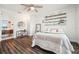 Inviting bedroom boasts sleek wood floors, serene decor, and sunlit ambiance at 7115 Bay St, St Pete Beach, FL 33706